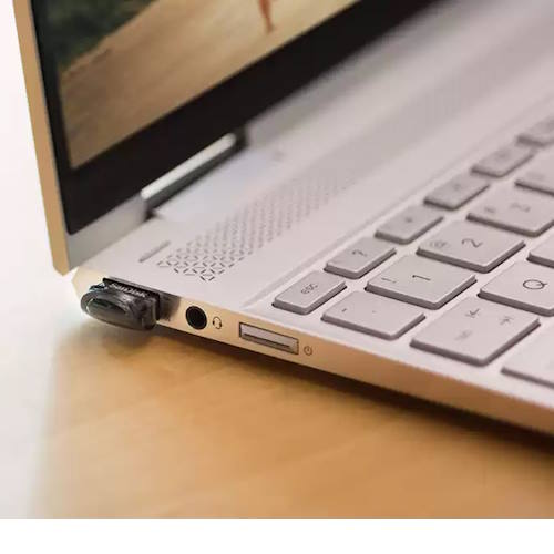 SanDisk Ultra Fit 64GB USB 3.2 Flash Drive – Low Profile, High Speed, Compact – SDCZ430-064G in a laptop USB port.