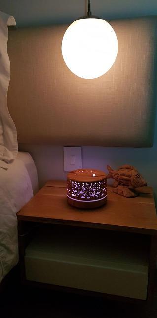 500ml Ultrasonic Aroma Diffuser - 7 Soothing LED Colors with under the sea design on wooden nightstand by bed