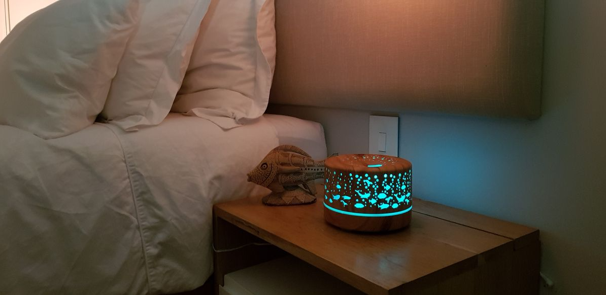 500ml Ultrasonic Aroma Diffuser - 7 Soothing LED Colors with under the sea design on bedside table by Aromispa