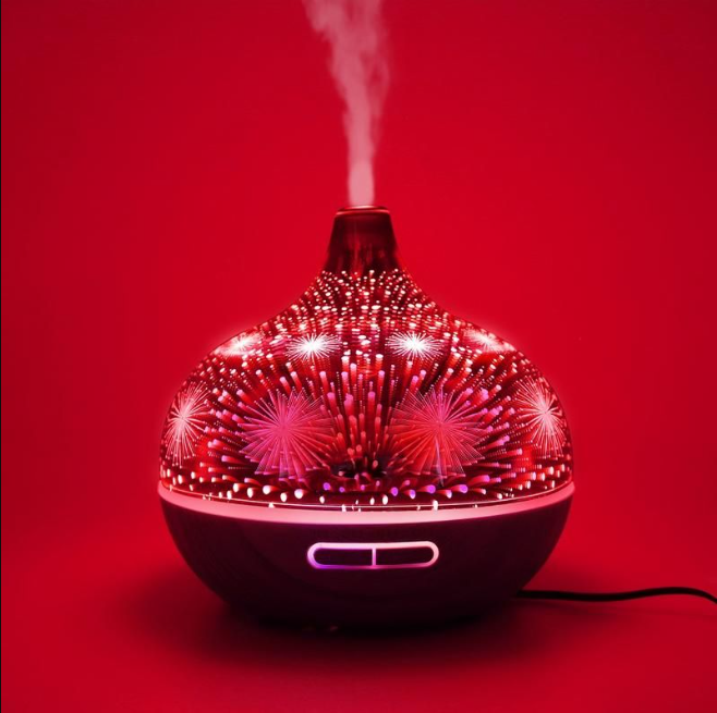 400ml Glass Aroma Diffuser with Firework Design featuring 3D lights and woodgrain base releasing soothing mist by Vitruvi.