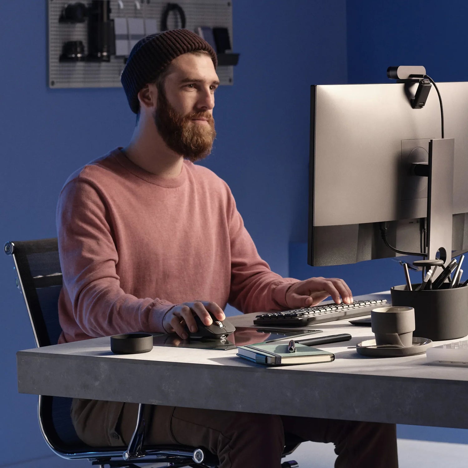 Logitech workspace with keyboard, mouse and webcam