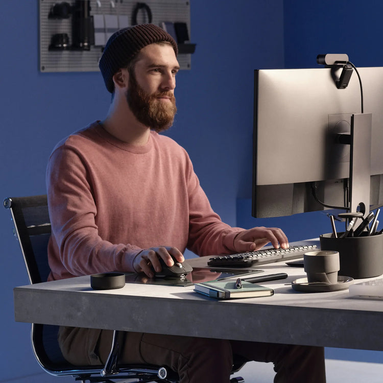 Logitech workspace with keyboard, mouse and webcam