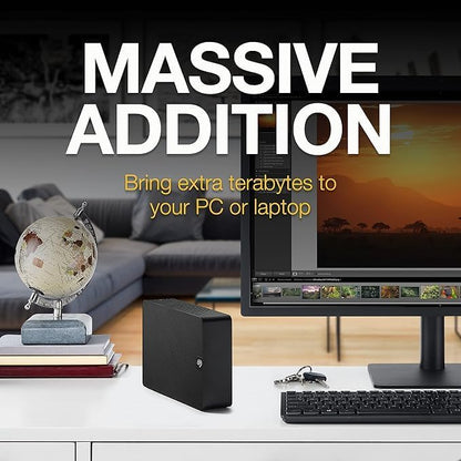 Seagate Expansion 28TB External Hard Drive – USB 3.0 Desktop HDD with Rescue Services, STKP28000400 on desk by monitor