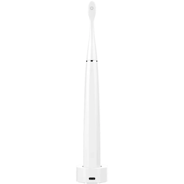 Rear view of the Aeno DB1S Sonic Electric toothbrush in white on charging station on a white background