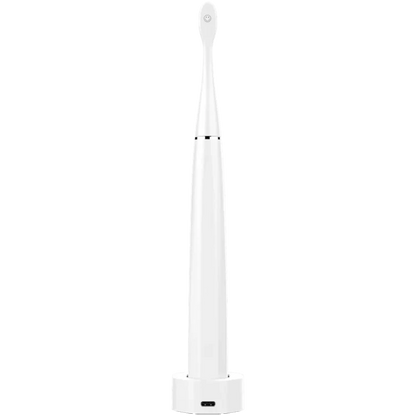 Rear view of the Aeno DB1S Sonic Electric toothbrush in white on charging station on a white background
