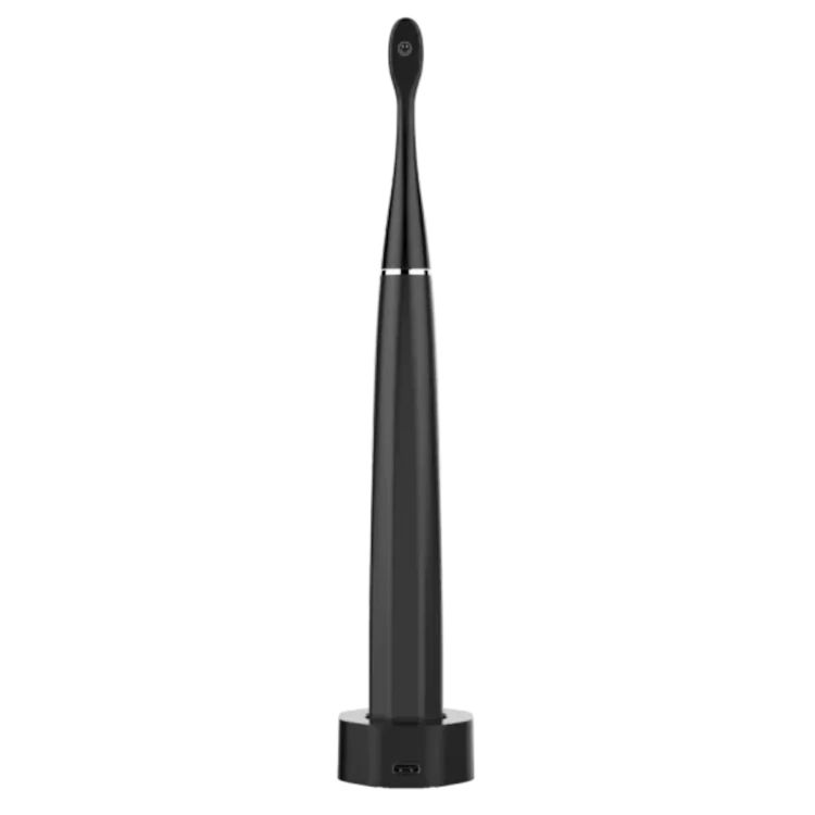 Rear view of the Aeno DS2S Black electric toothbrush in charging station on a white background