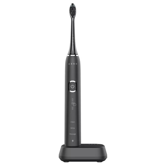 Front view of the black Aeno DB4 Sonic electric toothbrush with charging stand on a white background