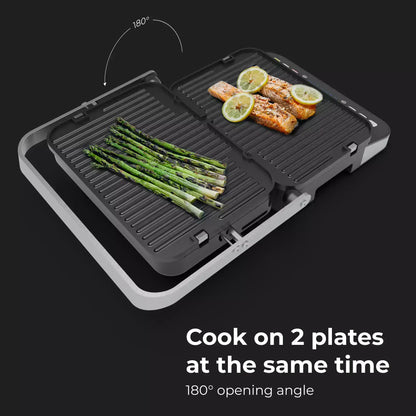 Aeno EG1 Dual cooking plate with salmon and asparagus on a black background