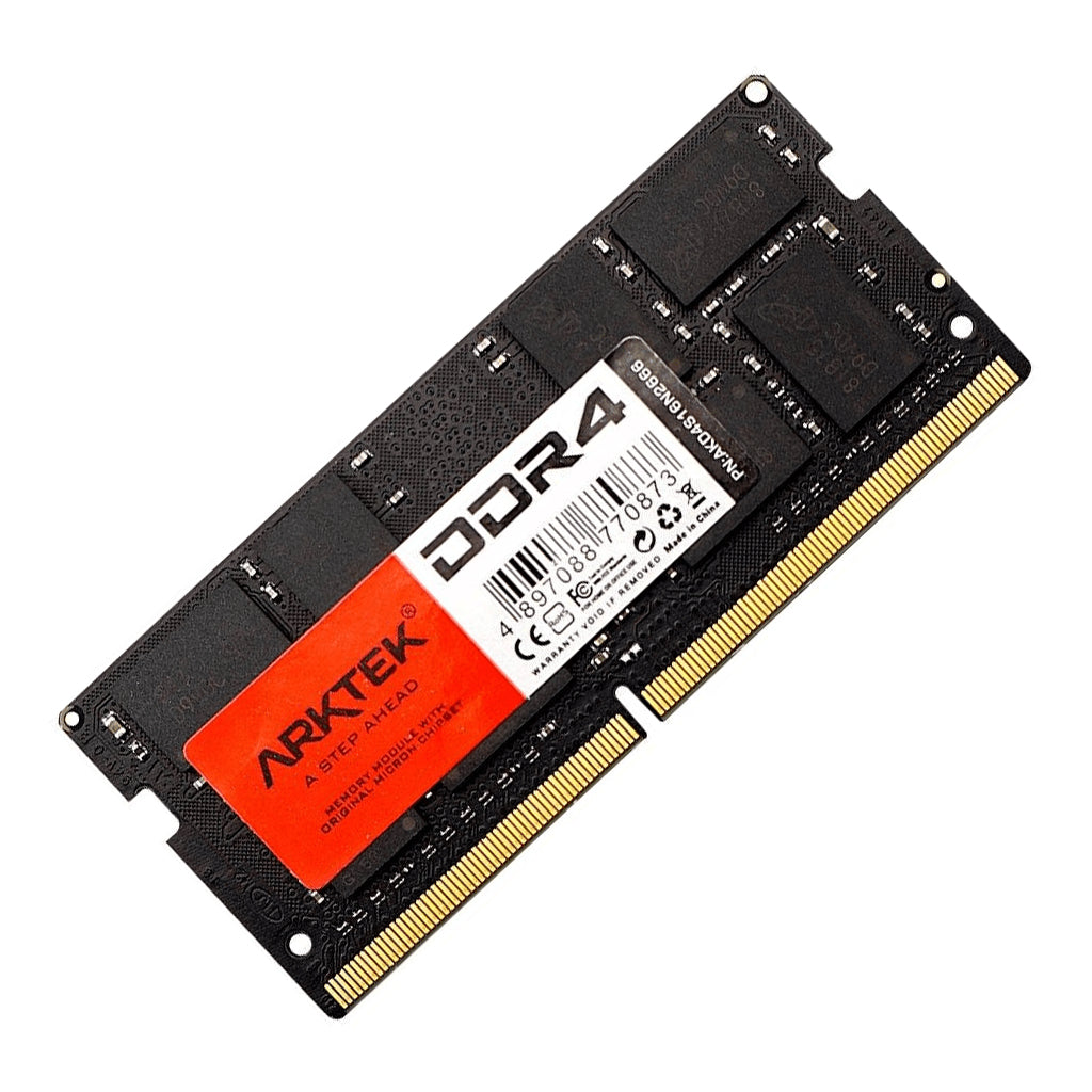 Memory module next to a laptop motherboard.

