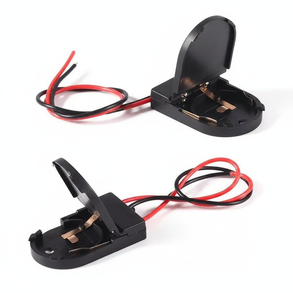 Front view of the M-Link CR2032 battery holder with its switch and wire leads.


