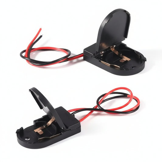 Front view of the M-Link CR2032 battery holder with its switch and wire leads.

