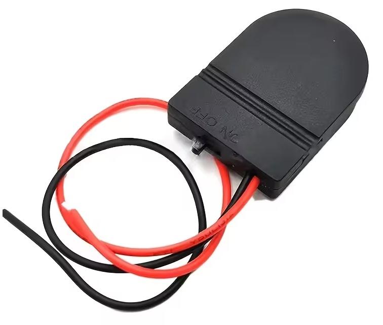The M-Link battery holder with a CR2032 coin cell installed in the compartment.

