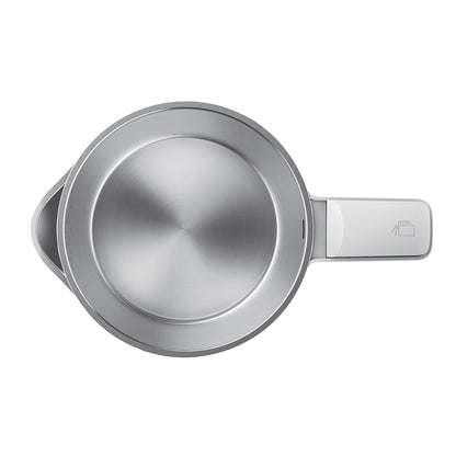 Stainless steel measuring cup on a white background