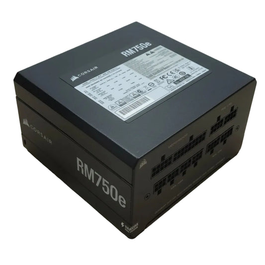 Black power supply unit box with 'RM750e' branding on a light wooden surface
