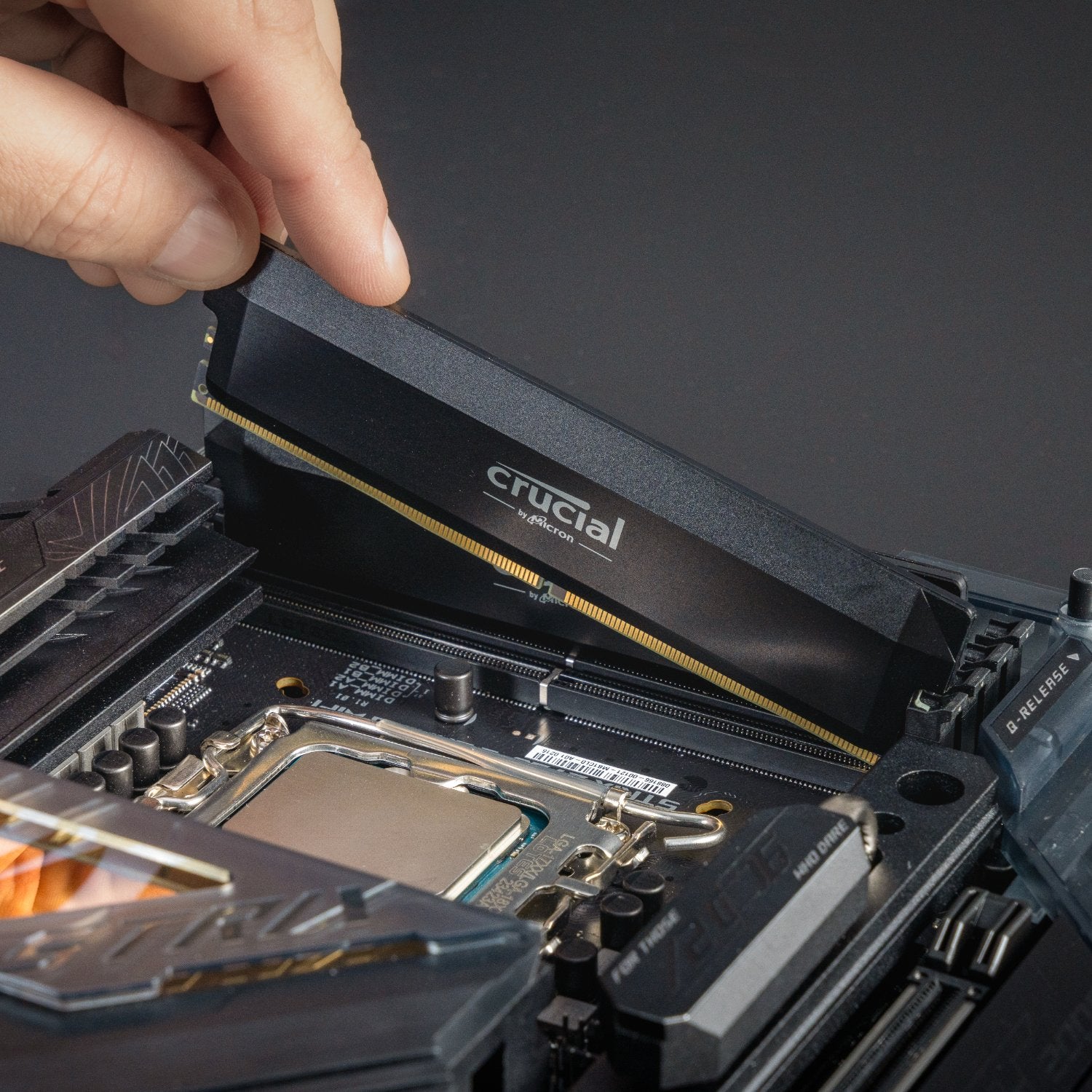 Crucial 16GB DDR5 6400MHz CL38 UDIMM Pro Overclocking Desktop Memory – Black High-Performance RAM being installed in a PC.