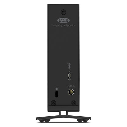 The hard drive placed next to a computer tower for size comparison.

