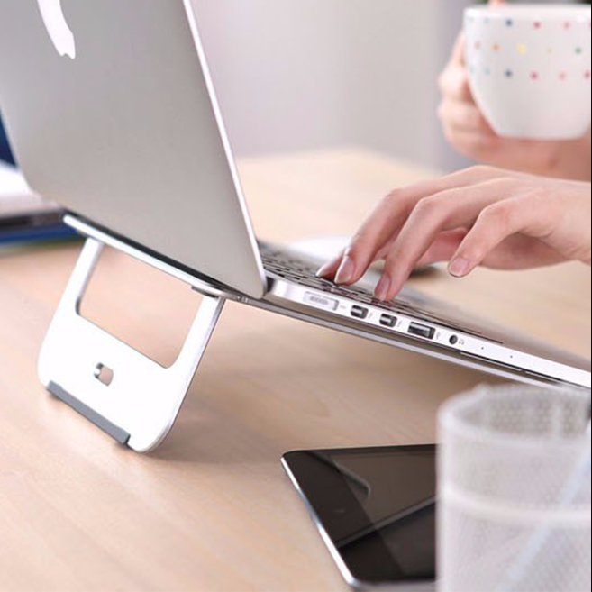 TBYTE Slim Aluminum Laptop Stand - Adjustable Cooling Riser for MacBook/PC elevates laptops for better ergonomics and airflow.