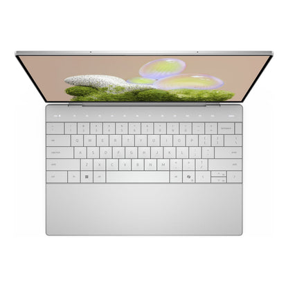 Laptop displaying Windows 11 Pro with Copilot interface.

