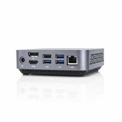 A compact silver mini PC or desktop computer shown from the rear, featuring multiple ports including DC, HDMI, USB, LAN, and DP on a clean white background.