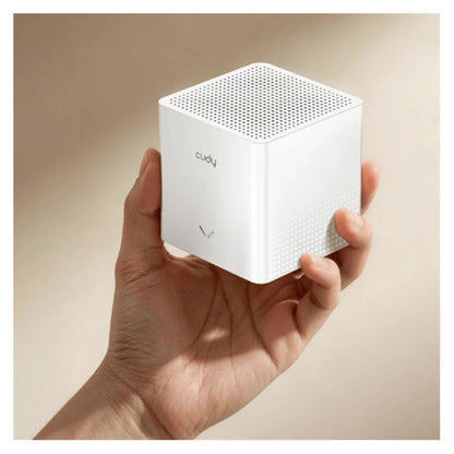 Cudy M1200 compact mesh Wi-Fi unit held in hand