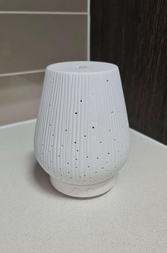 Silkinder Ceramic Starry Nights Diffuser – Aromatherapy & Nightlight in One creates a serene ambiance with a celestial glow.