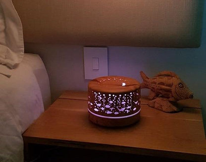 500ml Ultrasonic Aroma Diffuser - 7 Soothing LED Colors with under the sea design brightening a cozy bedroom space