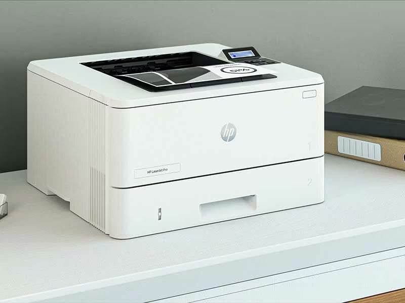 HP LaserJet Pro 4003Dn - High Speed Duplex Printing on white desk, HP logo visible, compact monochrome office printer